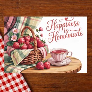 May include: A digital illustration featuring a basket overflowing with ripe strawberries, a teacup, and the text "Happiness is Homemade." The scene is set on a wooden surface with a checkered tablecloth.