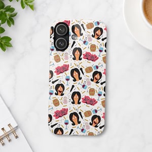 May include: White phone case with a repeating pattern of a cartoon woman, wine glasses, microphones, and the word "Alright!" in pink. The case has a glossy finish and a camera cutout.