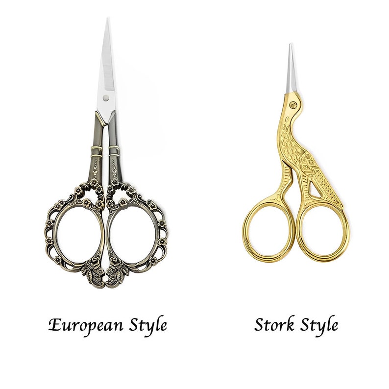 A pair of vintage-style scissors with stork-shaped handles. The scissors come with a wooden box that has a magnetic closure and a custom name or message engraved on it. It is a unique gift for seamstresses.