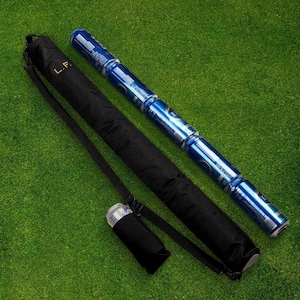 May include: A black insulated drinks carrier with a shoulder strap and the letters "L.F." embroidered on the side. The carrier is holding a stack of blue and silver aluminium drinks cans.