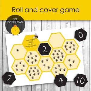 May include: A printable "Roll and Cover" game with a bee theme. The game board features a honeycomb design with numbers and illustrations of bees. Includes a yellow background with black hexagonal number tiles. The text reads "Roll and cover game".