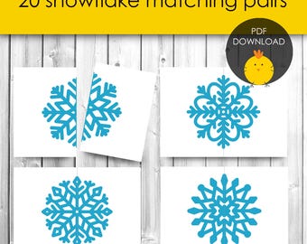 May include: Printable PDF download of 20 snowflake matching pairs.  The image shows four examples of the blue snowflake designs.