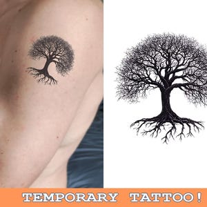 May include: A temporary tattoo of a black tree with roots. The tree has many branches and a thick trunk. The tattoo is on a person's arm.
