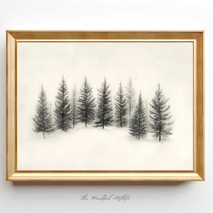 May include: A black and white drawing of a row of pine trees in a gold frame. The drawing is on a white background. The text "The Mandal Artist" is written in cursive at the bottom of the frame.