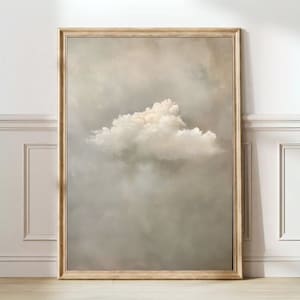 Puede incluir: Una pintura enmarcada de una sola nube blanca y esponjosa contra un cielo gris claro.