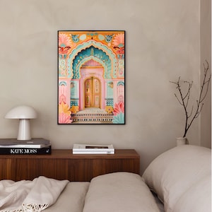 May include: A framed print of a colorful, ornate doorway with a pink archway and a teal and gold door. The doorway is decorated with intricate floral designs and geometric patterns.