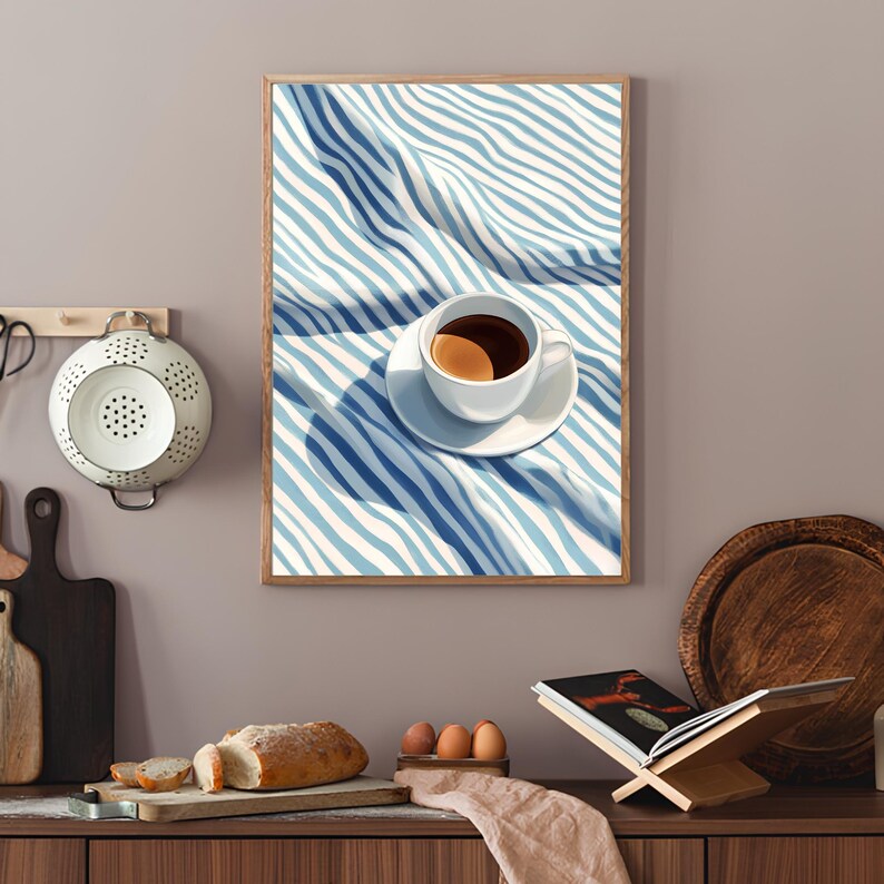 May include: A white coffee cup with a brown coffee inside, sitting on a white saucer on a blue and white striped tablecloth.