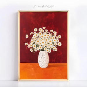 May include: A painting of a bouquet of white daisies in a white ceramic vase with black polka dots. The vase is sitting on a table with a red background.