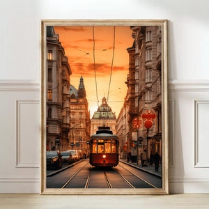 May include: A red vintage-style tram travels down a street lined with old buildings in a European city. The buildings are tall and have a yellow facade. The tram is traveling on a track with a golden glow in the background.