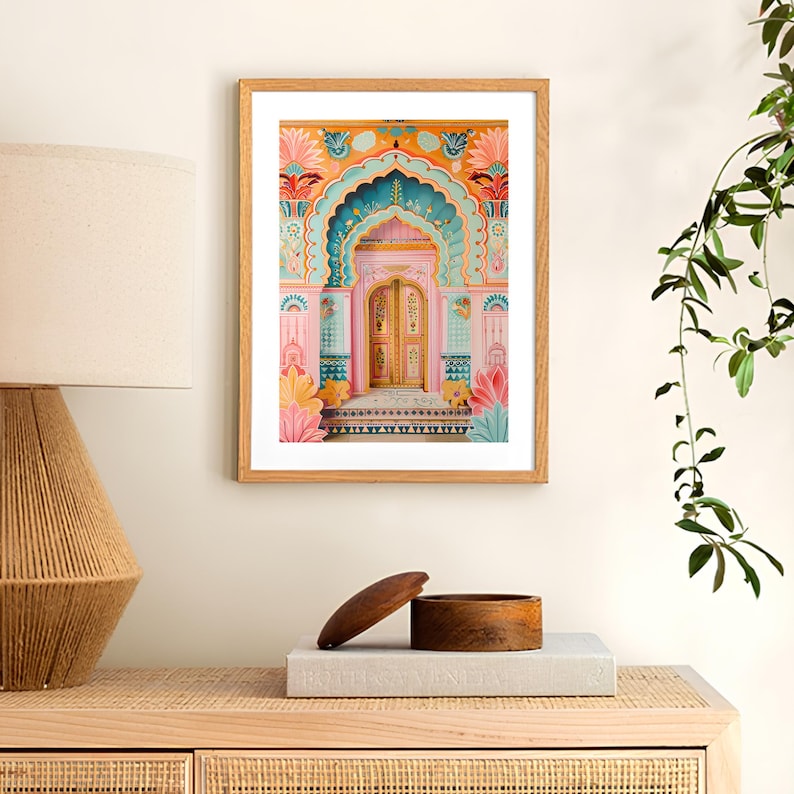 May include: A framed print of a colorful doorway with intricate details. The doorway is painted in shades of pink, blue, and yellow, with a golden door. The doorway is surrounded by a decorative archway with floral motifs.