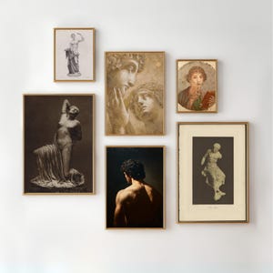 May include: A collection of framed art prints featuring classical sculptures and portraits. The prints are in gold frames and include images of statues, busts, and figures. The artwork is displayed on a white wall.