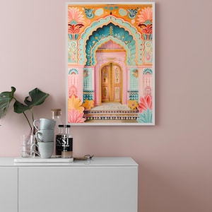 May include: A framed print of a colorful, ornate doorway with a pink archway and a wooden door with intricate details. The doorway is decorated with floral patterns and geometric designs in shades of pink, blue, yellow, and green.