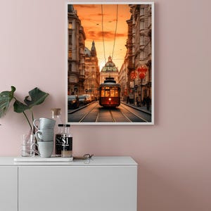 May include: A vintage red streetcar travels down a city street at sunset. The street is lined with tall buildings and the sky is a vibrant orange.