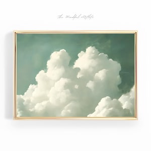 Könnte beinhalten: Ein gerahmtes Gemälde einer großen, flauschigen weißen Wolke vor einem hellgrünen Himmel. Das Gemälde ist in einem goldenen Rahmen.