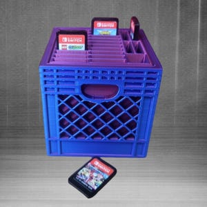 May include: A purple plastic crate with slots for storing Nintendo Switch game cartridges. The crate has a handle on the top and is filled with game cartridges. A single game cartridge is shown in the foreground.