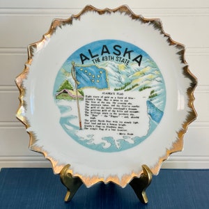 Placa conmemorativa vintage del 49.º estado de Alaska: placa estatal con detalles dorados y efecto sol.