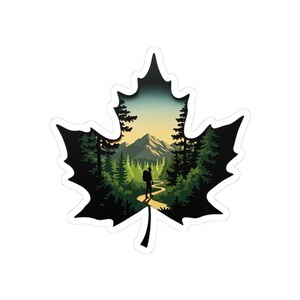 May include: A sticker in the shape of a maple leaf featuring a scenic landscape. The design shows a person hiking on a path through a forest, with mountains in the background. The color palette includes green, black, and shades of yellow.