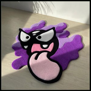 Handgemaakt, op maat gemaakt vloerkleed toont een geliefd stripfiguur - perfect cadeau voor vrienden en schattig interieur