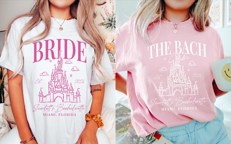 two women wearing t-shirts with the same design, which appears to be a castle or palace-themed design. The t-shirts are pink and white in color, and both women are wearing bracelets.