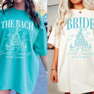 two different t-shirt designs featuring a castle and the text "The Bach" and "Bridal" printed on them.