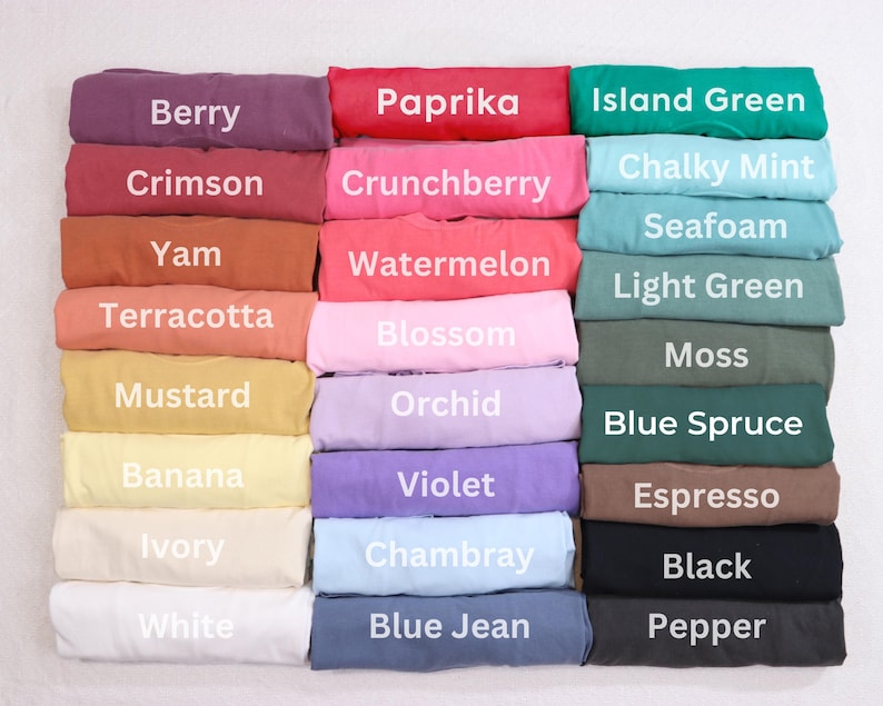 a collection of colorful t-shirts arranged in a grid-like pattern, with each color labeled.