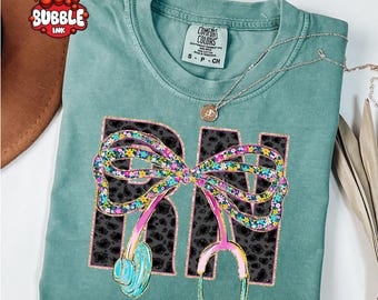 Comfort Colors® RN Coquette Bow Shirt, Registered Nurse Shirt, Cute Nurse Gift, Nurse Life Shirt, Nursing School Elementary Crewneck
