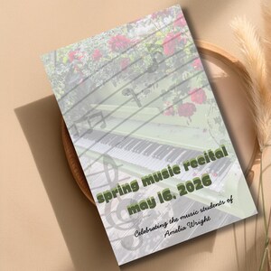 May include: A rectangular invitation card featuring a piano and red roses background with musical staff lines and a treble clef. The text reads: spring music recital may 16, 2026 Celebrating the music students of Amelia Wright in dark green font.