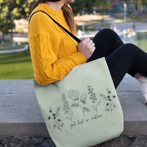 Get lost in nature with this high-quality, practical Flower Tote Bag. Embrace the outdoors in style!