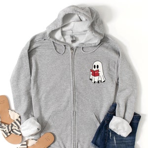 Ghost Reading Zip-Up Hoodie, Haunted by Horror, Spooky Must-Have for Book Lovers, Horror Novel, Bookworm Gift
