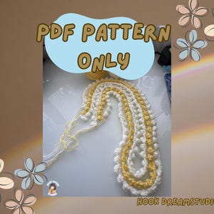 May include: A handmade crochet pattern in white and yellow, with the text "PDF PATTERN ONLY" in a blue bubble. The crochet piece is laid out on a white surface. The Hook Dream Studios logo is visible.