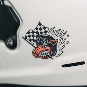 Fast Johnnie hog sticker on a helmet