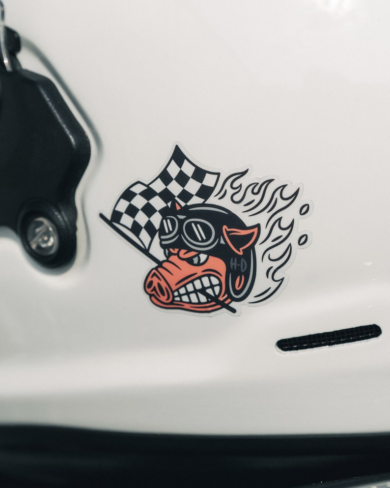 Fast Johnnie hog sticker on a helmet