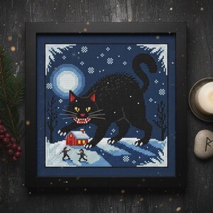 Yule Cat Cross Stitch Pattern Jólakötturinn. Finished cross stitch in a dark frame with festive Norse Christmas decor