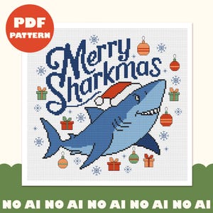 May include: A cross stitch pattern featuring a blue shark wearing a red and white Santa hat. The text Merry Sharkmas is written in dark blue above the shark. The design includes colourful gift boxes, round ornaments, and snowflakes.