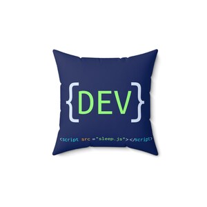 May include: Square throw pillow with a navy blue background. The pillow features the word "DEV" in green, enclosed in white brackets. Below the word is the code: <script src = "sleep.js"></script>.