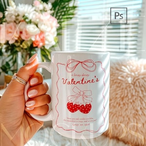 Hand held mug mockup featuring a 15oz ceramic coffee cup with Valentine themed typography design. Clean lifestyle background with soft light and cozy atmosphere. Fully editable mug body using PSD smart object or Canva drag and drop template. Trendy mugs mockup perfect for seasonal designs, gifts, and high quality 15oz mug mockup previews.