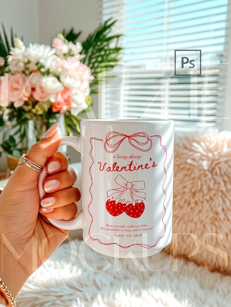 Hand held mug mockup featuring a 15oz ceramic coffee cup with Valentine themed typography design. Clean lifestyle background with soft light and cozy atmosphere. Fully editable mug body using PSD smart object or Canva drag and drop template. Trendy mugs mockup perfect for seasonal designs, gifts, and high quality 15oz mug mockup previews.