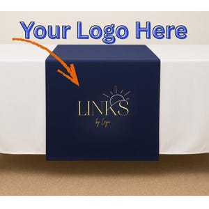 May include: A white tablecloth with a navy blue table runner. The table runner has gold text that reads "LINKS by Laya" with a sun and crescent moon design. The words "Your Logo Here" are at the top.