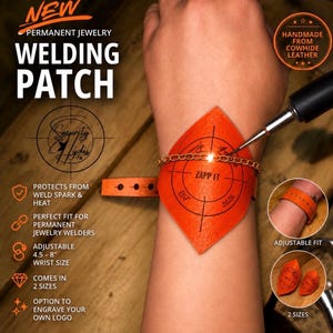 May include: An orange cowhide leather welding patch for permanent jewelry, featuring a target graphic with the text ZAPP IT EST 2025. The patch includes an adjustable strap for wrist sizes 4.5 to 8 inches, designed to protect skin from weld sparks and heat.