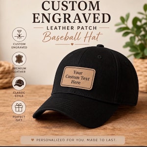 May include: A black baseball hat featuring a rectangular tan leather patch on the front. The patch is engraved with the text 'Your Custom Text Here'. The image includes text stating 'CUSTOM ENGRAVED LEATHER PATCH Baseball Hat' and 'PERSONALIZED FOR YOU. MADE TO LAST.'