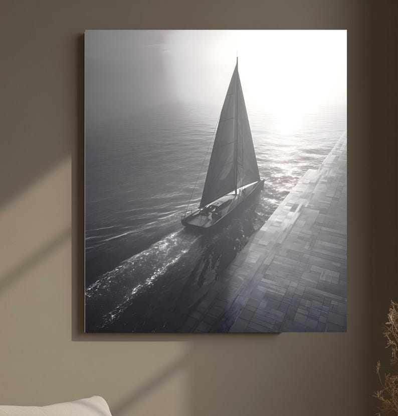 May include: A black and white photograph of a sailboat sailing on the ocean. The sailboat has a tall mast and sail, and is moving through the water. The sun is shining brightly in the background, creating a hazy effect.