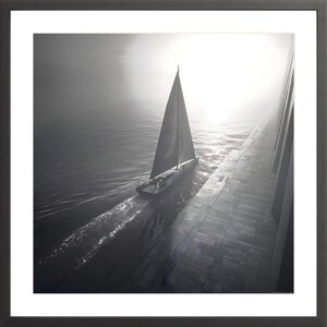 May include: Black and white framed print of a sailboat on the water. The sailboat is sailing towards the sun, with a large wall on the right side of the image. The image is framed in a black frame.