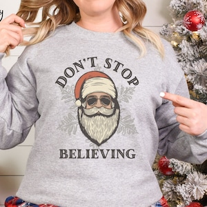 Don&#39;t Stop Believing Sweatshirt, Funny Christmas Sweater, Cool Santa Pullover Gift for Holidays, Gag Gift White Elephant Ugly Sweater Party