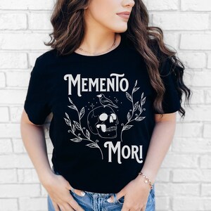 Memento Mori Symbol Shirt, Stylish Philosophical Tees, Reflective Fashion Statements, Skull Crow Design Feminine, Remember to Die Stoicism