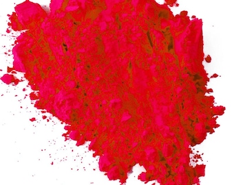 May include: A pile of bright pink powder, likely used for Holi celebrations or as a colorful pigment.