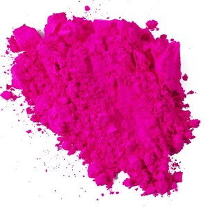 May include: A pile of bright pink powder, likely used for Holi celebrations or as a colourful pigment.