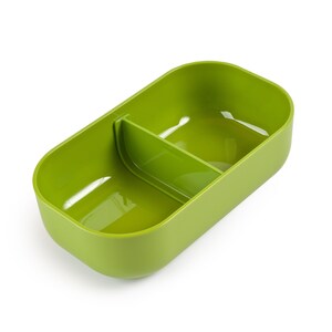 May include: A green plastic divided lunch container with two compartments. The container is empty and ready to be filled with food.