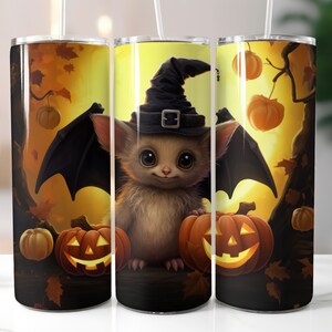 May include: A set of three stainless steel tumblers with a Halloween theme. The tumblers feature a cute bat with a witch's hat, pumpkins, and autumn leaves.