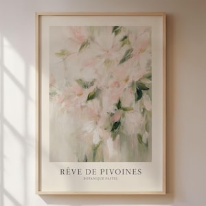 May include: A framed art print featuring a soft, impressionistic floral painting. The artwork showcases delicate pink and white flowers with green leaves against a muted background. The text "R&ecirc;ve de Pivoines Botanique Pastel" is at the bottom.