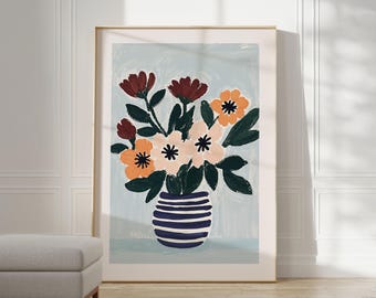 May include: A framed illustration of a bouquet of flowers in a blue and white striped vase. The flowers are a mix of orange, pink, and red.